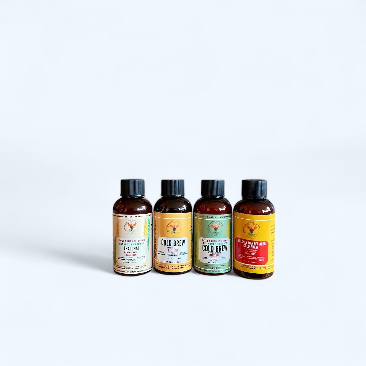 2oz Travel Cold Brew & Thai Chai Tea Concentrated Set of 4 - Rising For People Coffee Co.CoffeeRising For People Coffee Co.Rising For People Coffee Co.Rising for People Coffee concentrate bottles—2oz Travel Cold Brew & Thai Chai Tea Concentrated Set of 4 (Original cold brew, Whiskey Barrel cold brew, Happy Mushroom cold brew, Happy Mushroom Thai chai) Perfect for lattes, baking, cooking, and baking, Latte, Cappuccino, Coffee shop, Coffee shop near, Coffee near me, Roasted coffee, Speciality coff