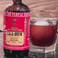 Rising for People Coffee cold brew bottle- organic specialty Guatemala coffee aged in an uncle nearest whiskey barrel for 30 days, roast light, ultra caffeine, Latte,
Cappuccino, 
Coffee shop,
Coffee shop near, 
Coffee near me,
Roasted coffee,
Speciality coffee,
Green coffee,
Black coffee,
Espresso machine,
French press,
Espresso,
Takeout coffee near