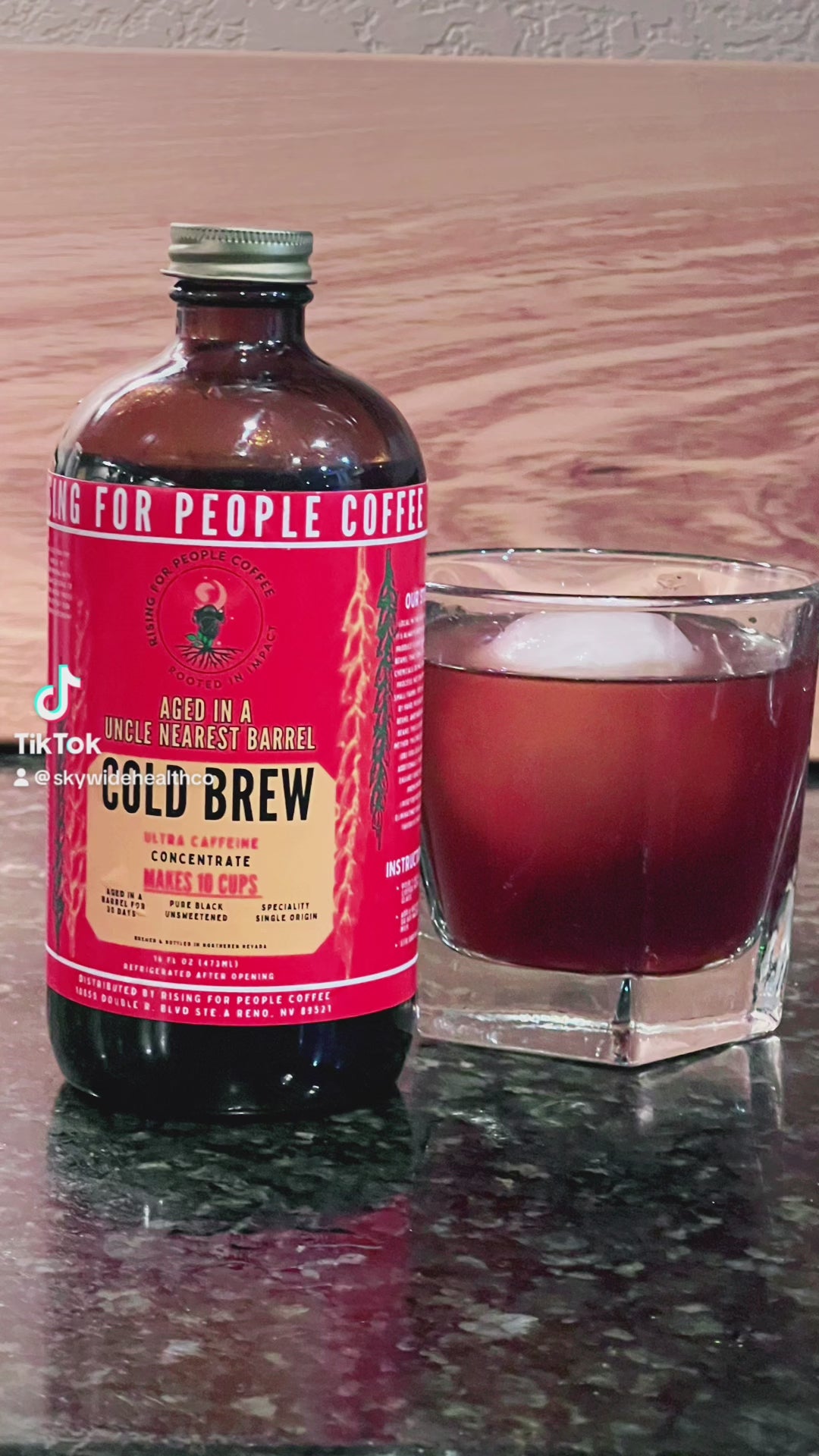 Rising for People Coffee cold brew bottle- organic specialty Guatemala coffee aged in an uncle nearest whiskey barrel for 30 days, roast light, ultra caffeine, Latte,
Cappuccino, 
Coffee shop,
Coffee shop near, 
Coffee near me,
Roasted coffee,
Speciality coffee,
Green coffee,
Black coffee,
Espresso machine,
French press,
Espresso,
Takeout coffee near